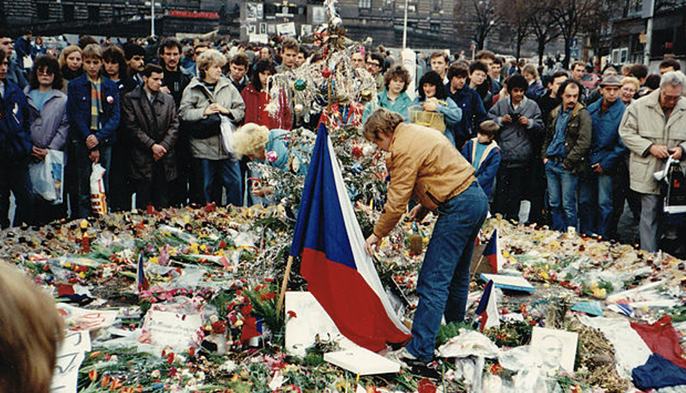 Vaclav Havel and demonstrators commemorate the struggle for freedom and democracy at the Prague memorial during the Velvet Revolution of 1989